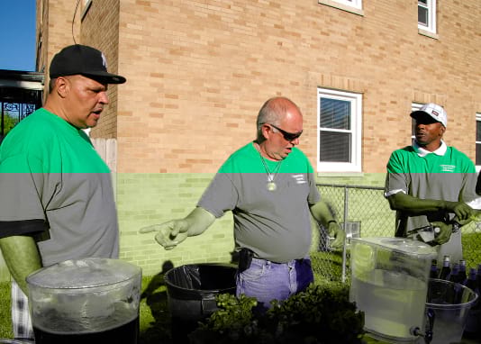 group of volunteers passing out beverages