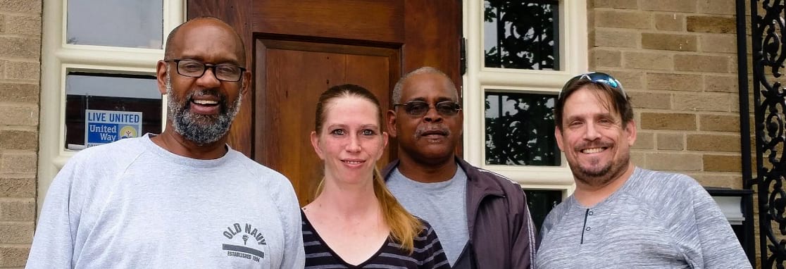 Group of people smiling for portrait