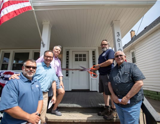 five gentleman smiling for portrait