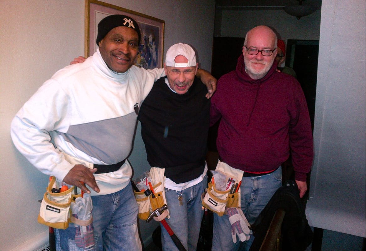 three gentleman smiling for portrait