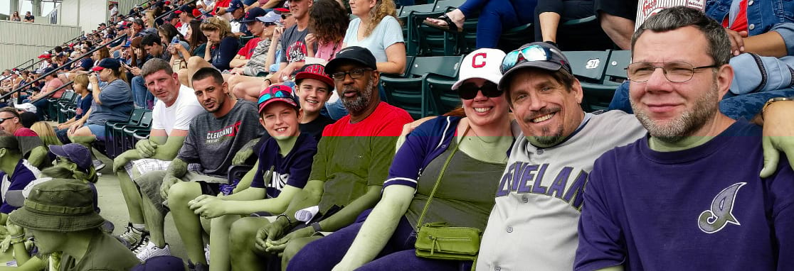 group of people at the indians game smiling for portrait