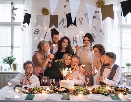 family and friends celebrating gentlemans birthday