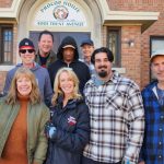 volunteers in front of CSA house